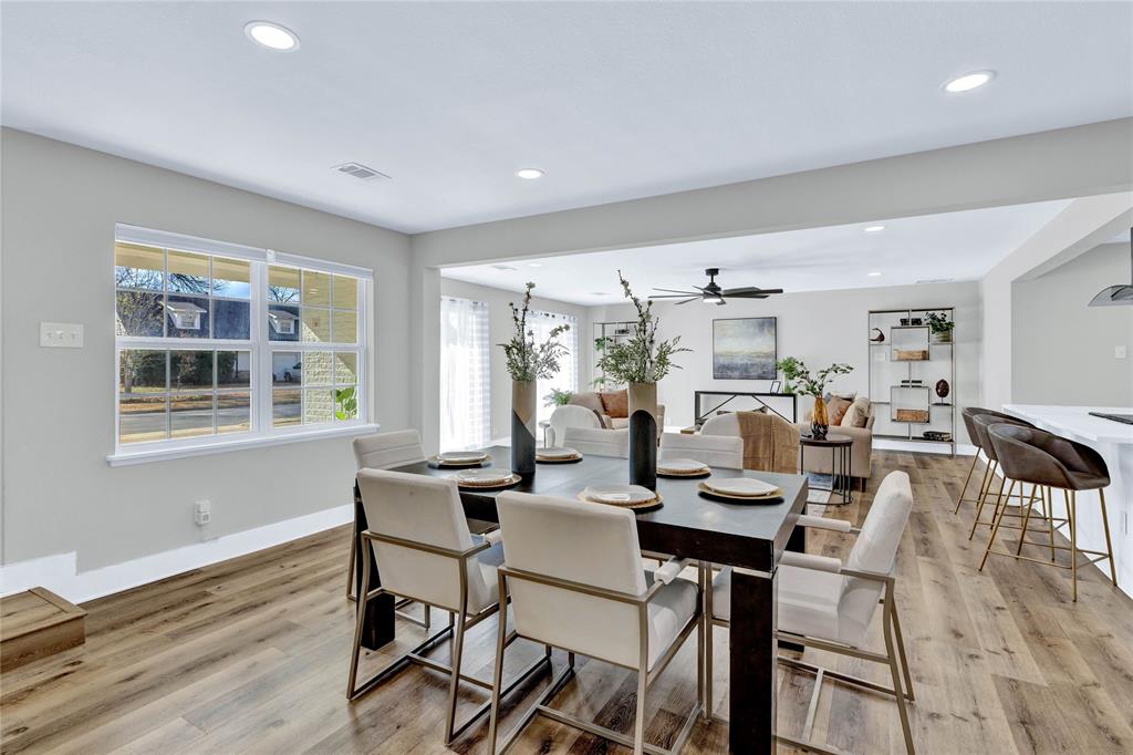 8635 Strathmore Drive Dallas, TX 75238 - Photo 12 of 35 a view of a dining room with furniture window and wooden floor