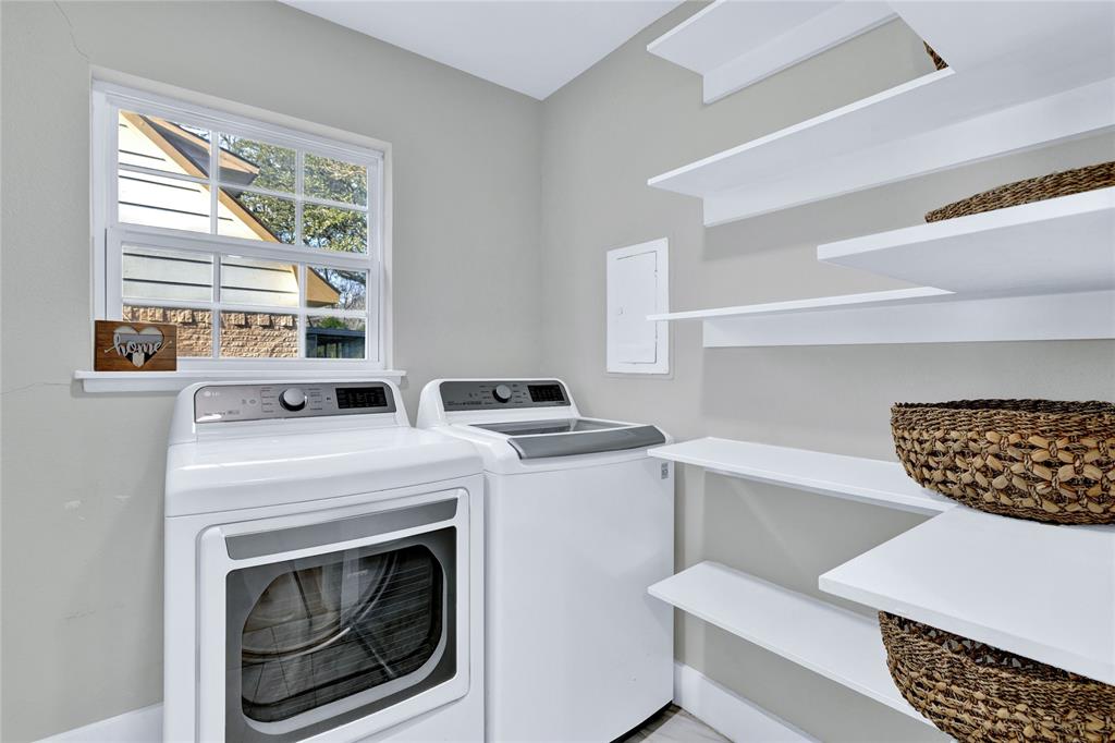 8635 Strathmore Drive Dallas, TX 75238 - Photo 13 of 35 a view of livingroom with washer and dryer