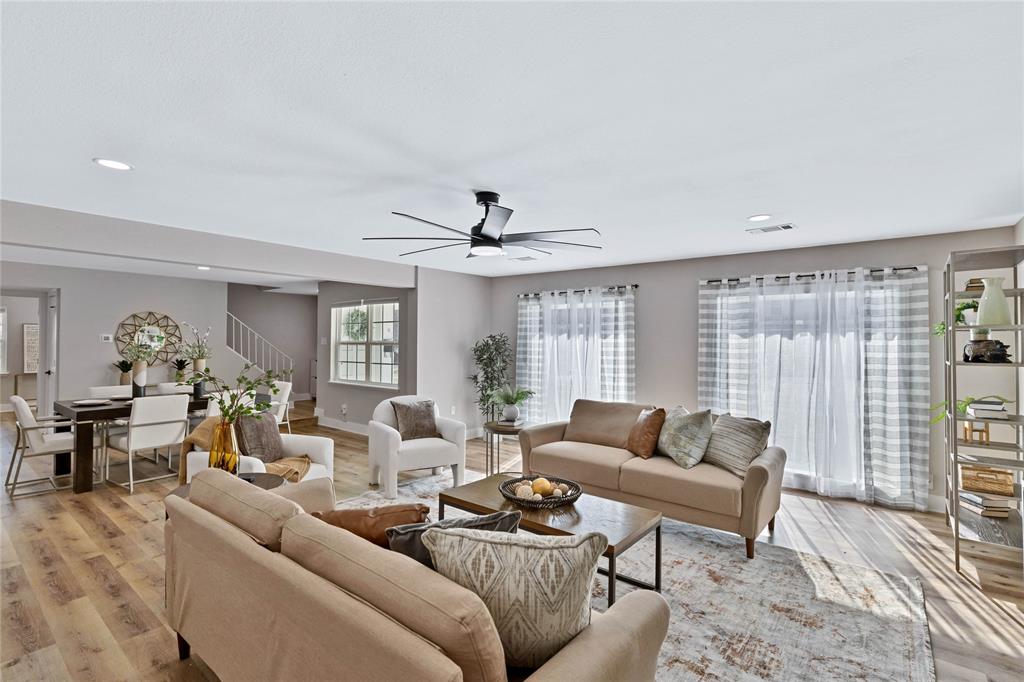 8635 Strathmore Drive Dallas, TX 75238 - Photo 14 of 35 a living room with furniture and a large window