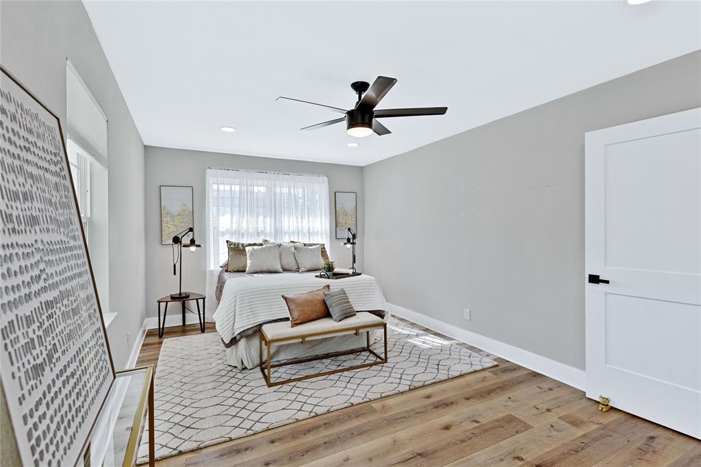 8635 Strathmore Drive Dallas, TX 75238 - Photo 16 of 35 a living room with furniture and a wooden floor