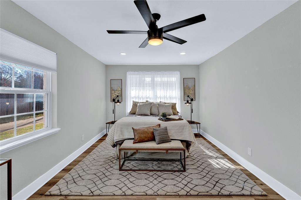 8635 Strathmore Drive Dallas, TX 75238 - Photo 17 of 35 a living room with furniture and a window