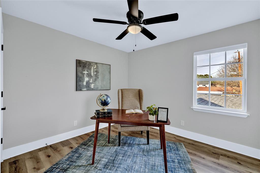 8635 Strathmore Drive Dallas, TX 75238 - Photo 22 of 35 a workspace room with furniture and wooden floor