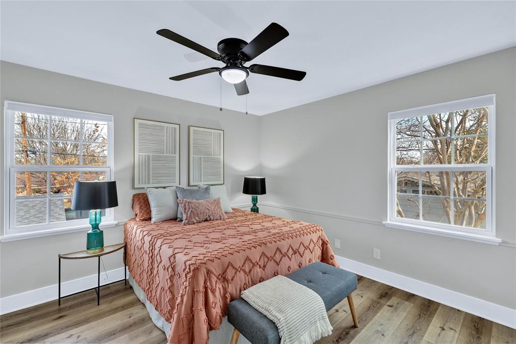 8635 Strathmore Drive Dallas, TX 75238 - Photo 24 of 35 a bedroom with a large bed and a window