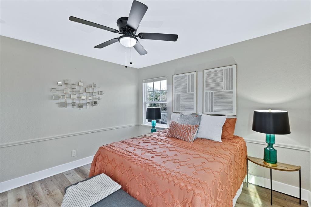 8635 Strathmore Drive Dallas, TX 75238 - Photo 25 of 35 a bedroom with a bed and window