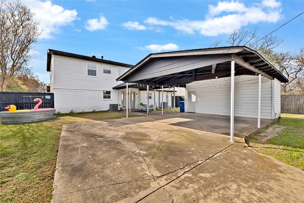 8635 Strathmore Drive Dallas, TX 75238 - Photo 28 of 35 a house with trees in the background