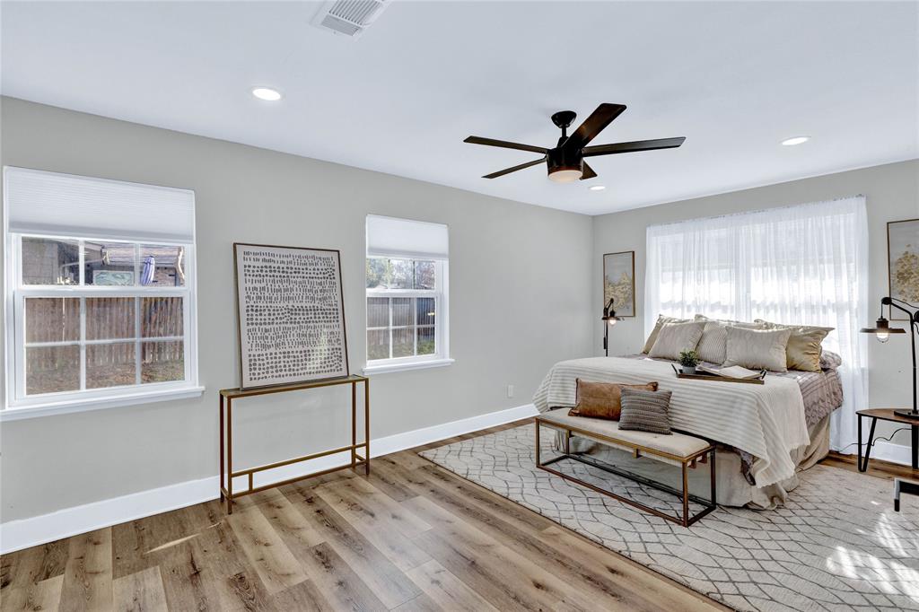 8635 Strathmore Drive Dallas, TX 75238 - Photo 4 of 35 a living room with furniture a window and a ceiling fan