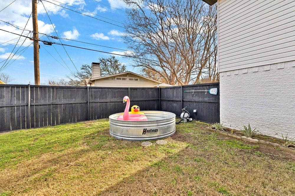 8635 Strathmore Drive Dallas, TX 75238 - Photo 5 of 35 a view of back yard of the house