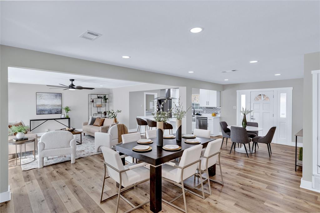 8635 Strathmore Drive Dallas, TX 75238 - Photo 6 of 35 a view of a dining room with furniture and wooden floor