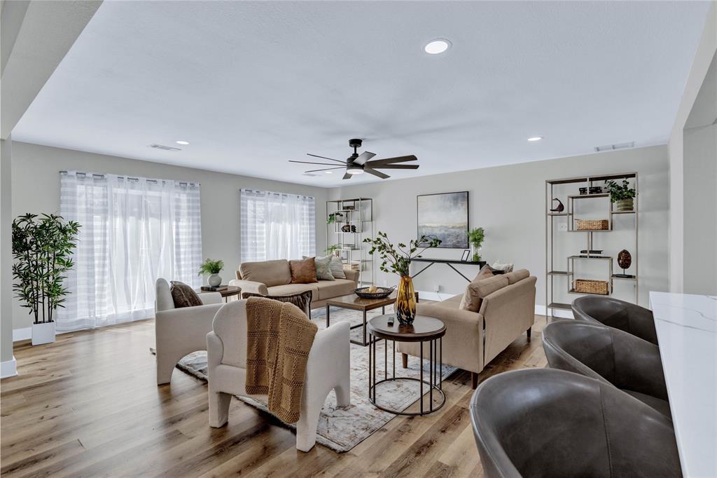 8635 Strathmore Drive Dallas, TX 75238 - Photo 7 of 35 a living room with furniture and a large window