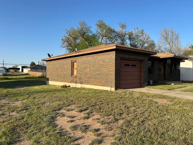 a house view with a backyard space