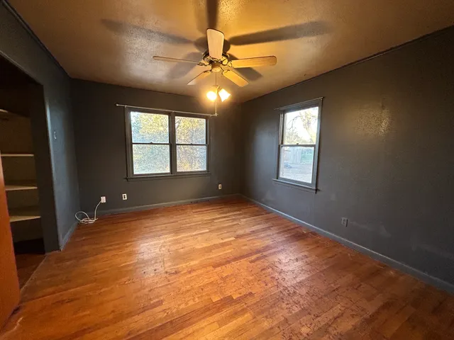 a bathroom with a toilet sink vanity tub and shower