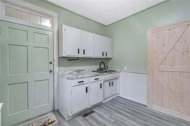 a view of cabinets with wooden floor