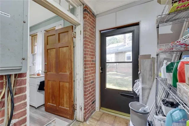 a bathroom with a toilet a sink and a large mirror