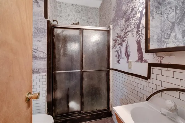 a bathroom with a bathtub and shower