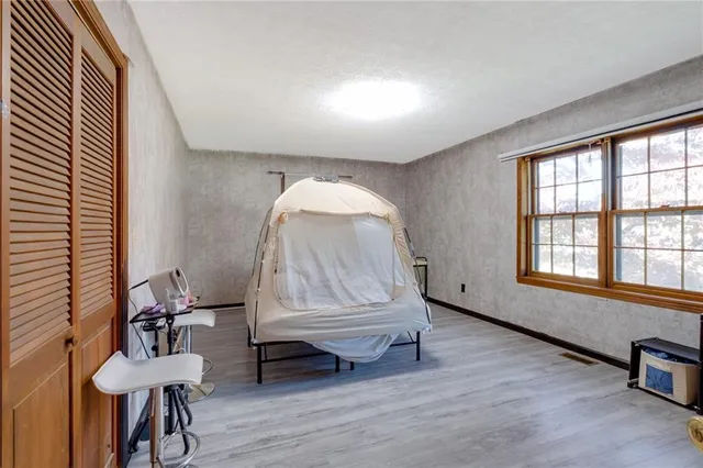 wooden floor in a room with a window