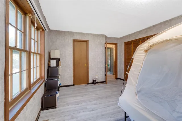 a view of entryway with wooden floor and stairs