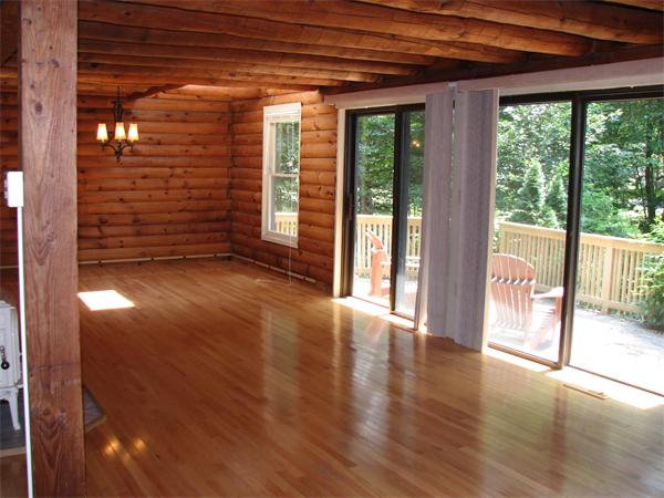 64 Baker Road Salisbury, MA 01952 - Photo 16 of 29 a view of an empty room with wooden floor and a window