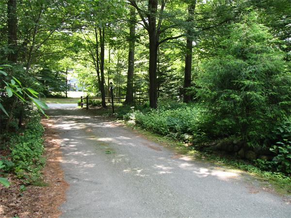 64 Baker Road Salisbury, MA 01952 - Photo 2 of 29 a view of a forest with trees