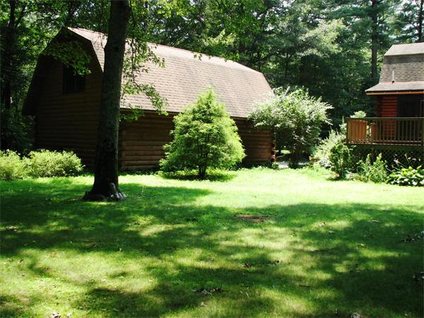 64 Baker Road Salisbury, MA 01952 - Photo 5 of 29 a view of backyard with potted plants and a bench