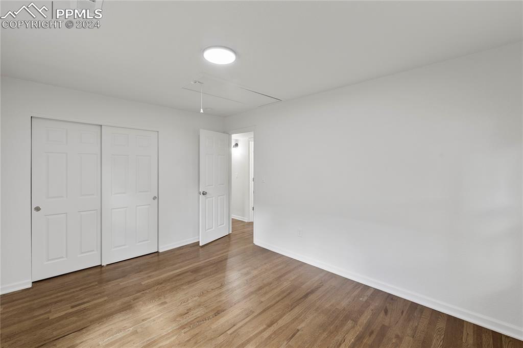 2615 East Boulder Street Colorado Springs, CO 80909 - Photo 16 of 50 a view of an empty room and wooden floor
