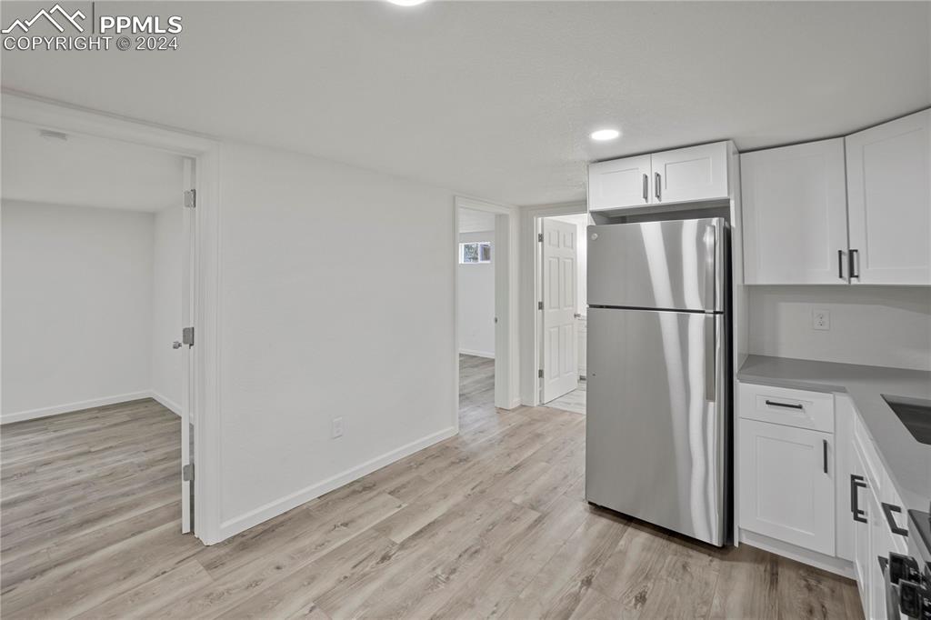 2615 East Boulder Street Colorado Springs, CO 80909 - Photo 23 of 50 a view of a kitchen with a refrigerator and a refrigerator