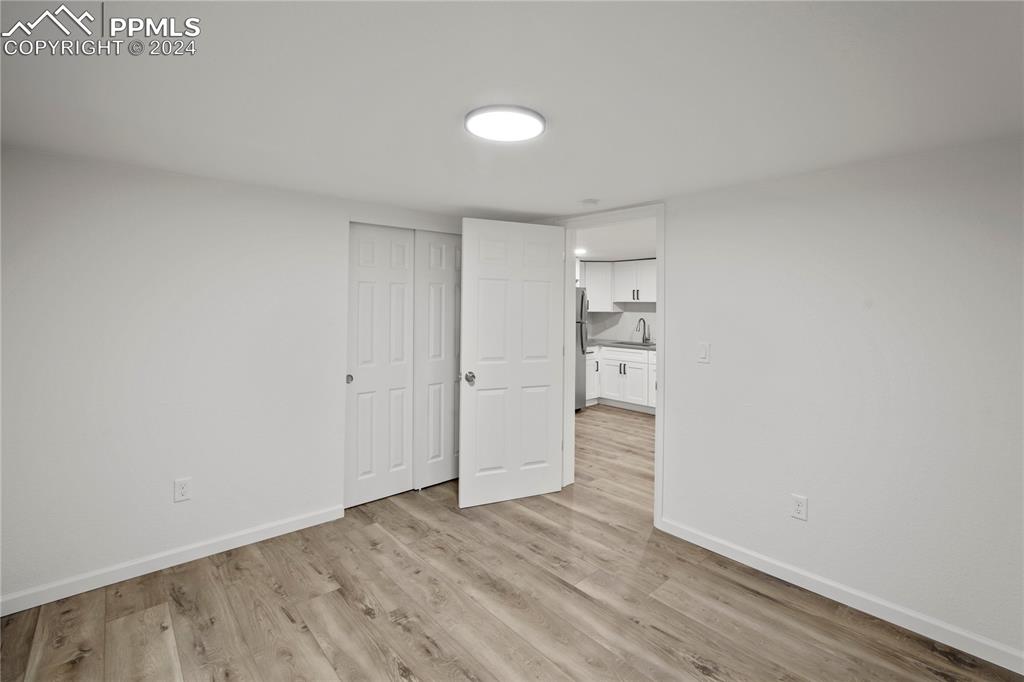 2615 East Boulder Street Colorado Springs, CO 80909 - Photo 27 of 50 a view of an empty room and wooden floor