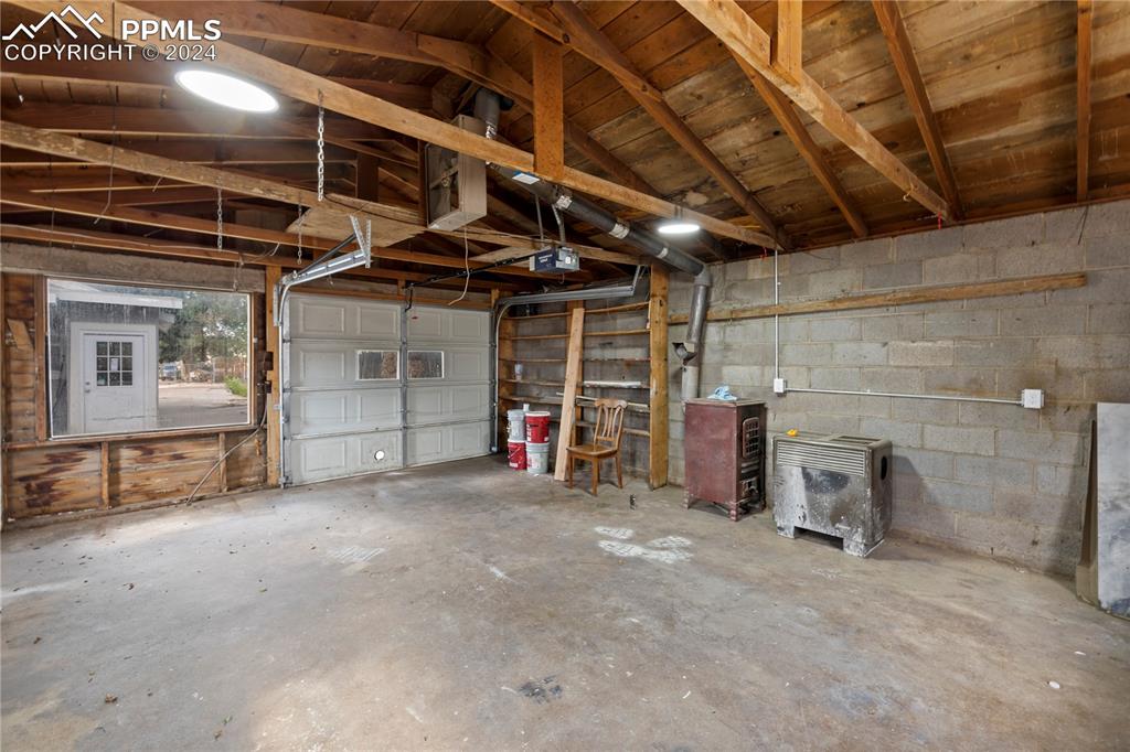 2615 East Boulder Street Colorado Springs, CO 80909 - Photo 37 of 50 a view of a empty room with a garage