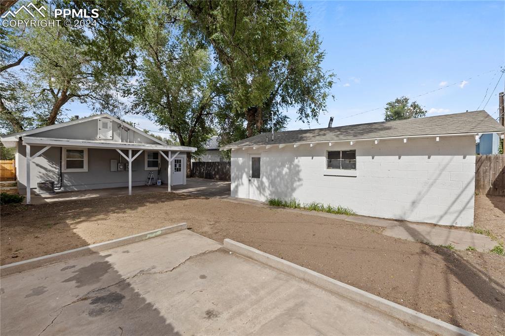 2615 East Boulder Street Colorado Springs, CO 80909 - Photo 39 of 50 a front view of a house with a garage