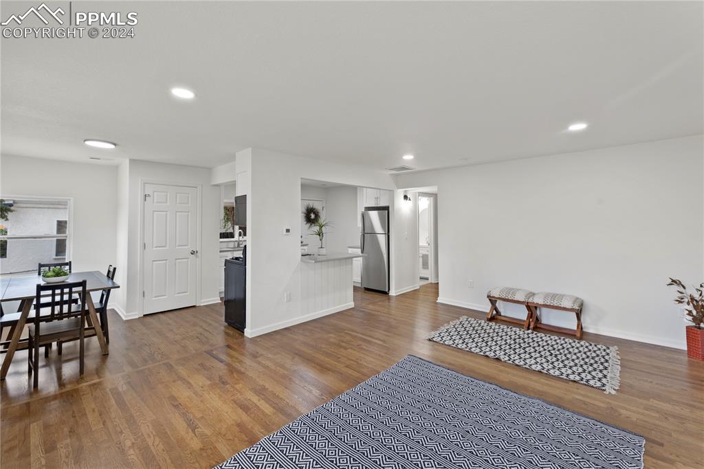 2615 East Boulder Street Colorado Springs, CO 80909 - Photo 4 of 50 a view of a livingroom with furniture and wooden floor
