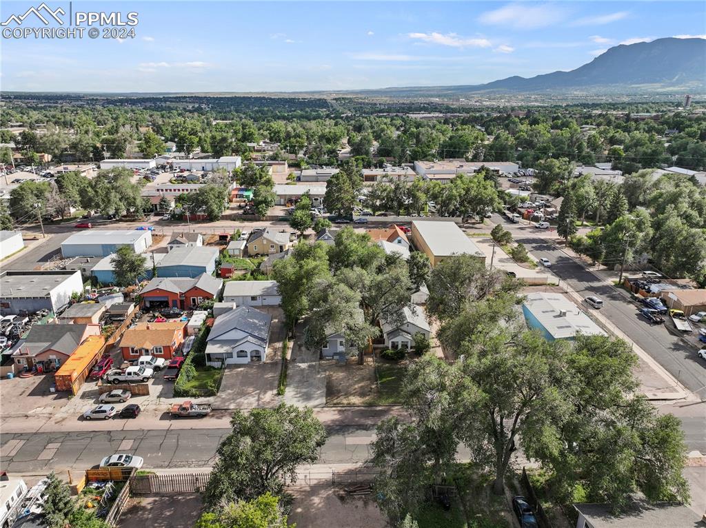 2615 East Boulder Street Colorado Springs, CO 80909 - Photo 46 of 50 an aerial view of a city with lots of residential buildings ocean and mountain view in back