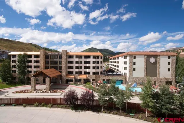 a front view of a building with garden