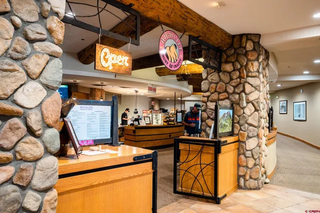 a view of swimming pool with an outdoor seating