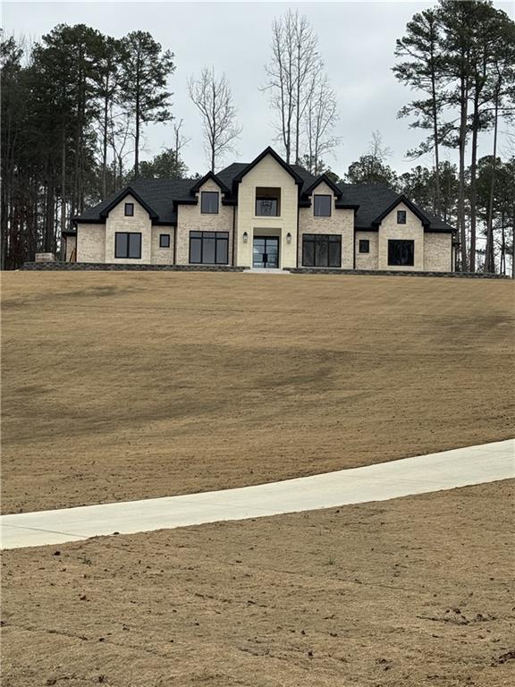 4521 Jack Pittman Road Monroe, GA 30656 - Photo 1 of 4 a front view of a house with a ocean view