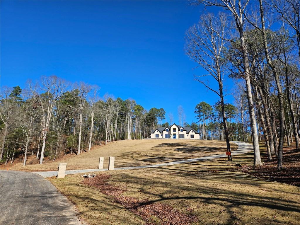 4521 Jack Pittman Road Monroe, GA 30656 - Photo 4 of 4 a view of a road with a building in the background