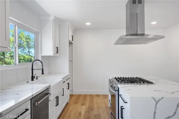 a kitchen with a sink and a window