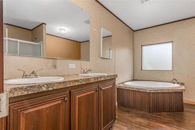 a bathroom with a granite countertop sink a toilet and a mirror
