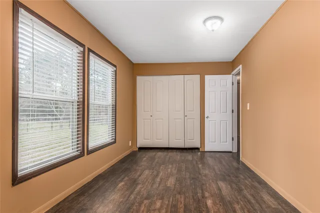a view of front door with wooden floor
