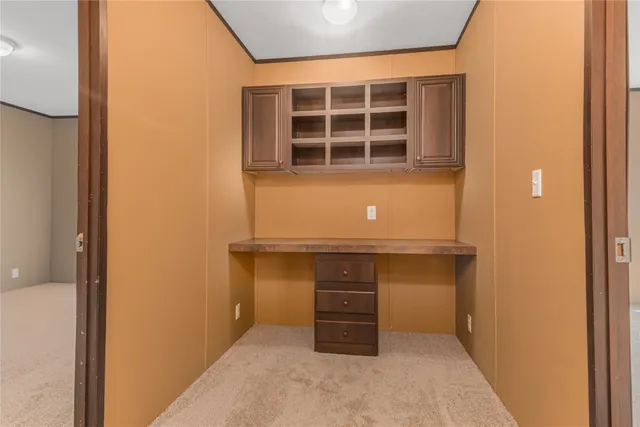 a room with a bench and more cabinets
