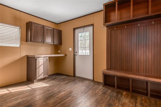 a view of room with window and wooden floor