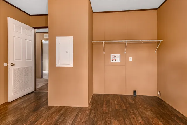 a view of a room with wooden floor