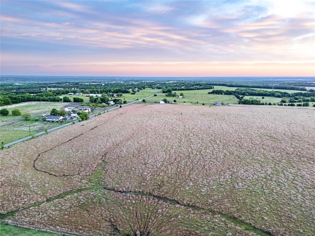 950 Old Ida Road Sherman, TX 75090 - Photo 9 of 15 a view of a road with a yard