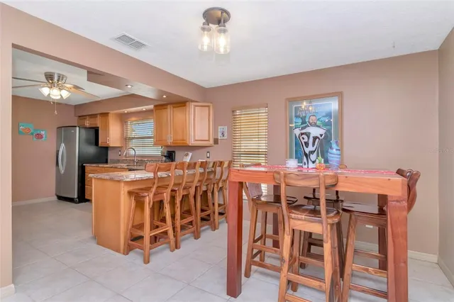 a dining room with furniture and window