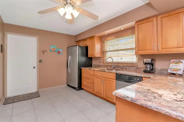a kitchen with sink cabinets and window