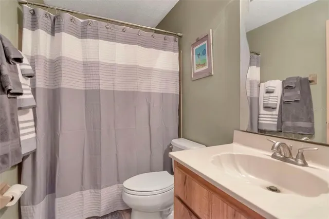 a view of a backyard with plants and a patio