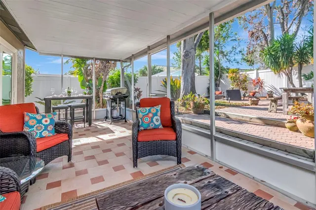 a view of backyard with plants and outdoor seating