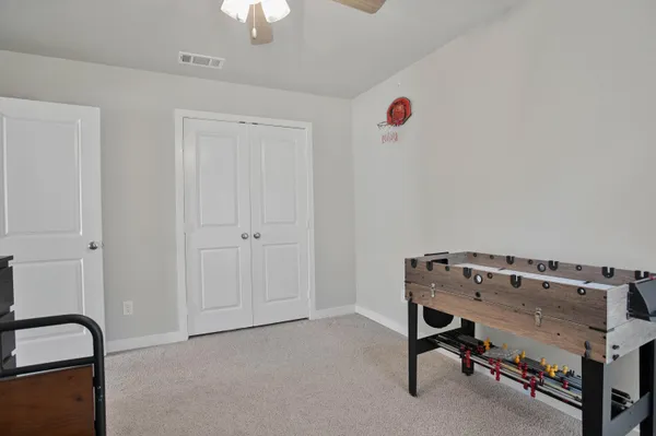a view of a storage and utility room with washer and dryer
