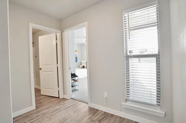 a view of a kitchen with wooden floor