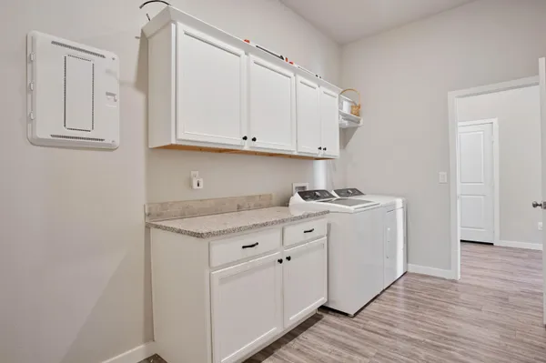 a bathroom with a granite countertop sink a mirror and a vanity
