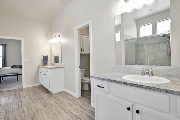 a room with pool table and ceiling fan