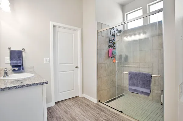 a bedroom with a bed and a couch